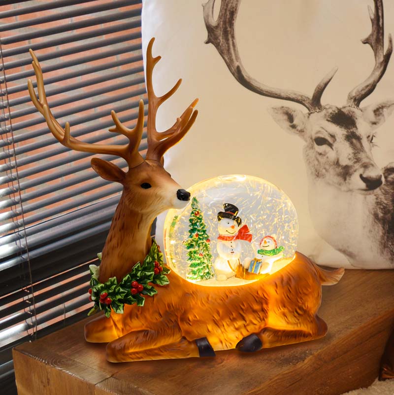 Renna natalizia glitter led con decorazione interna ed effetto luminoso h 26 cm