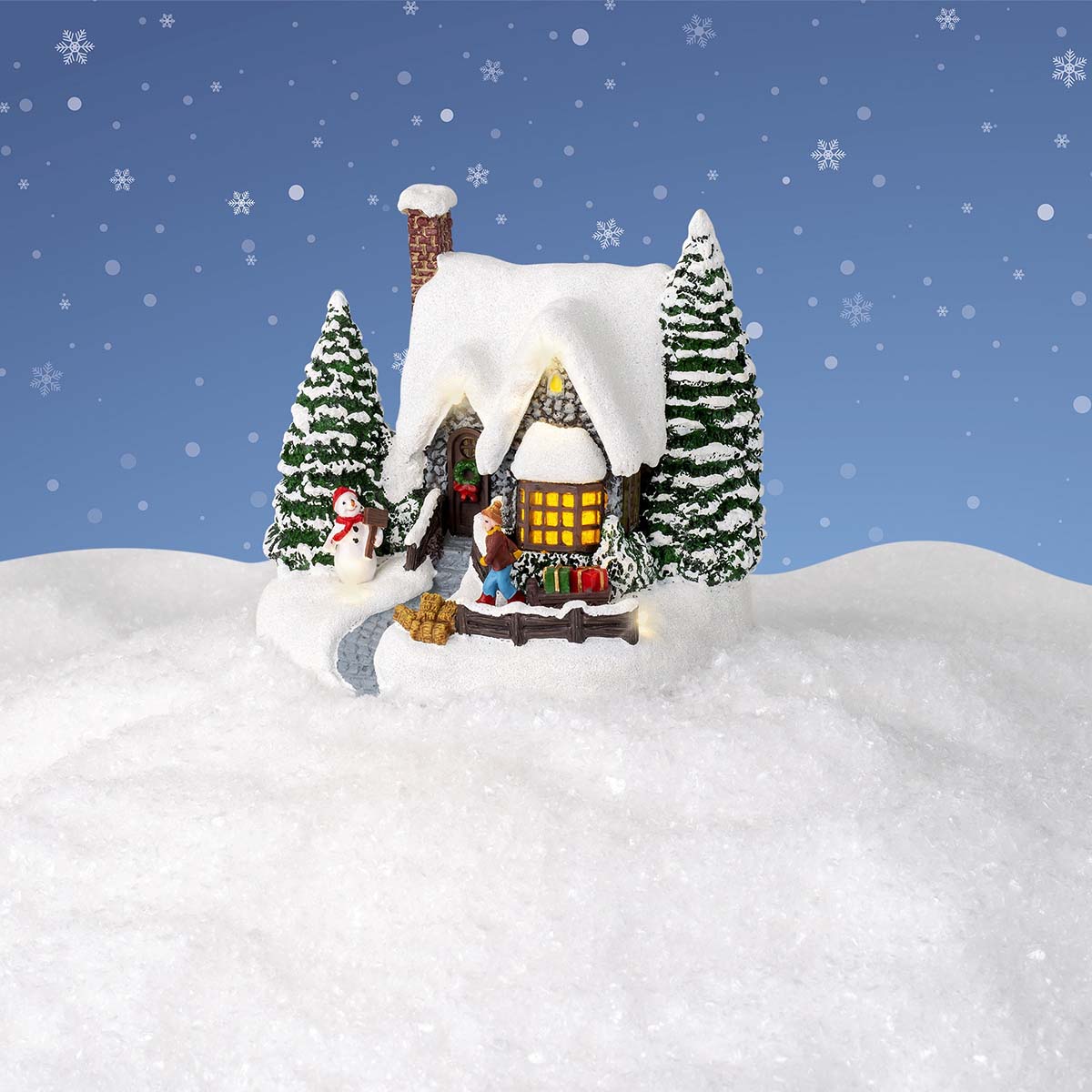 Casetta di Natale innevata con luci LED