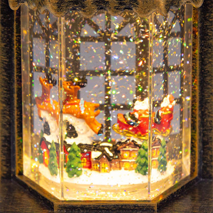 Casetta natalizia luminosa LED con glitter h 19,5 cm